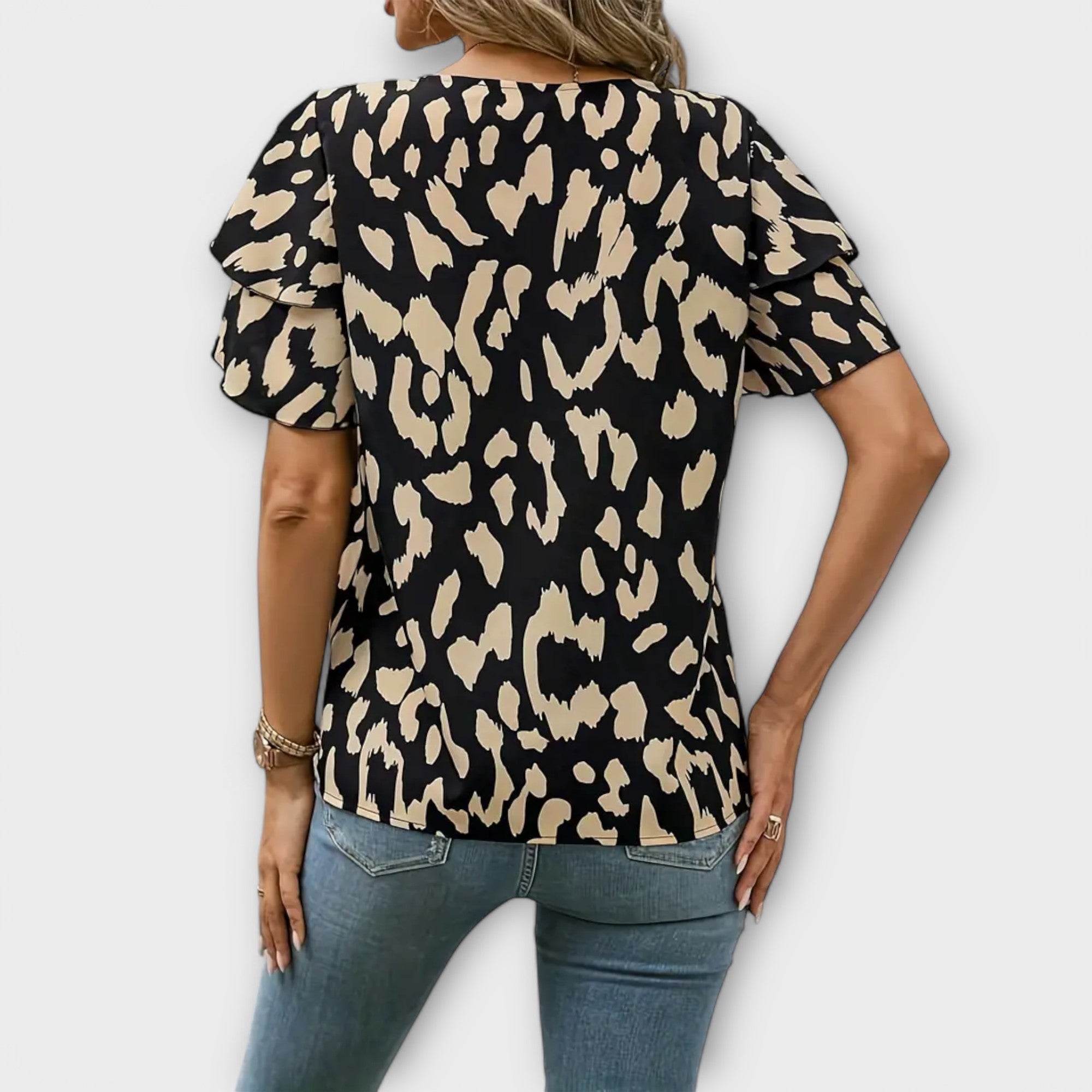 Lela - Elegant blouse with leopard sleeves
