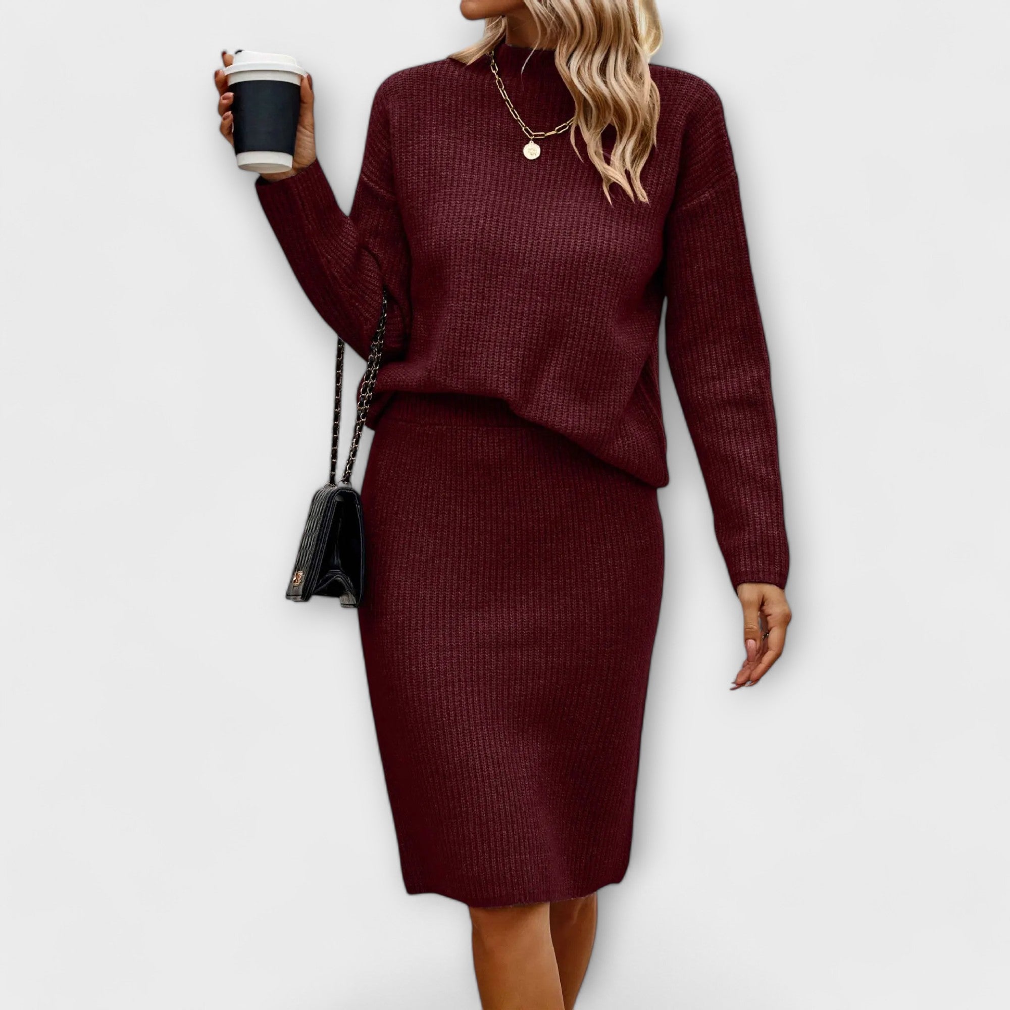 Complete with sweater and two-piece skirt.