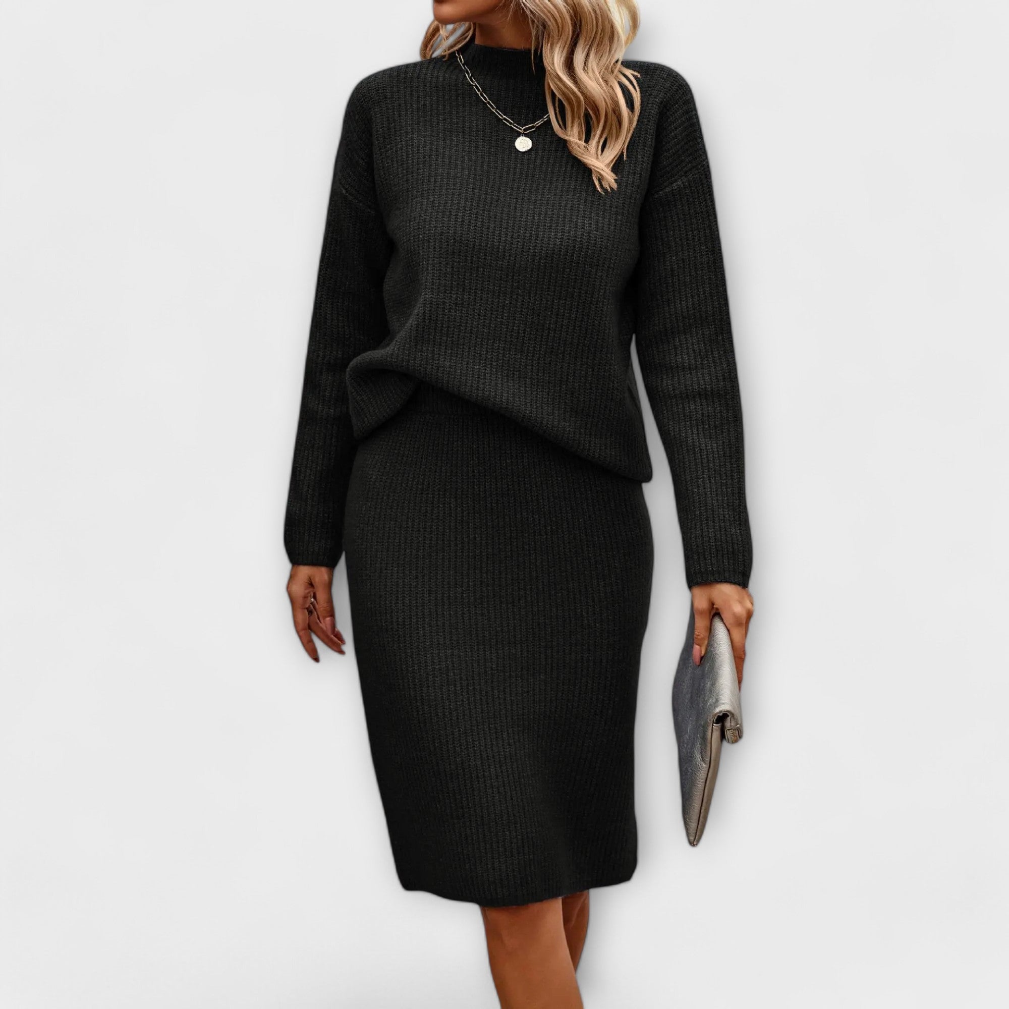 Complete with sweater and two-piece skirt.