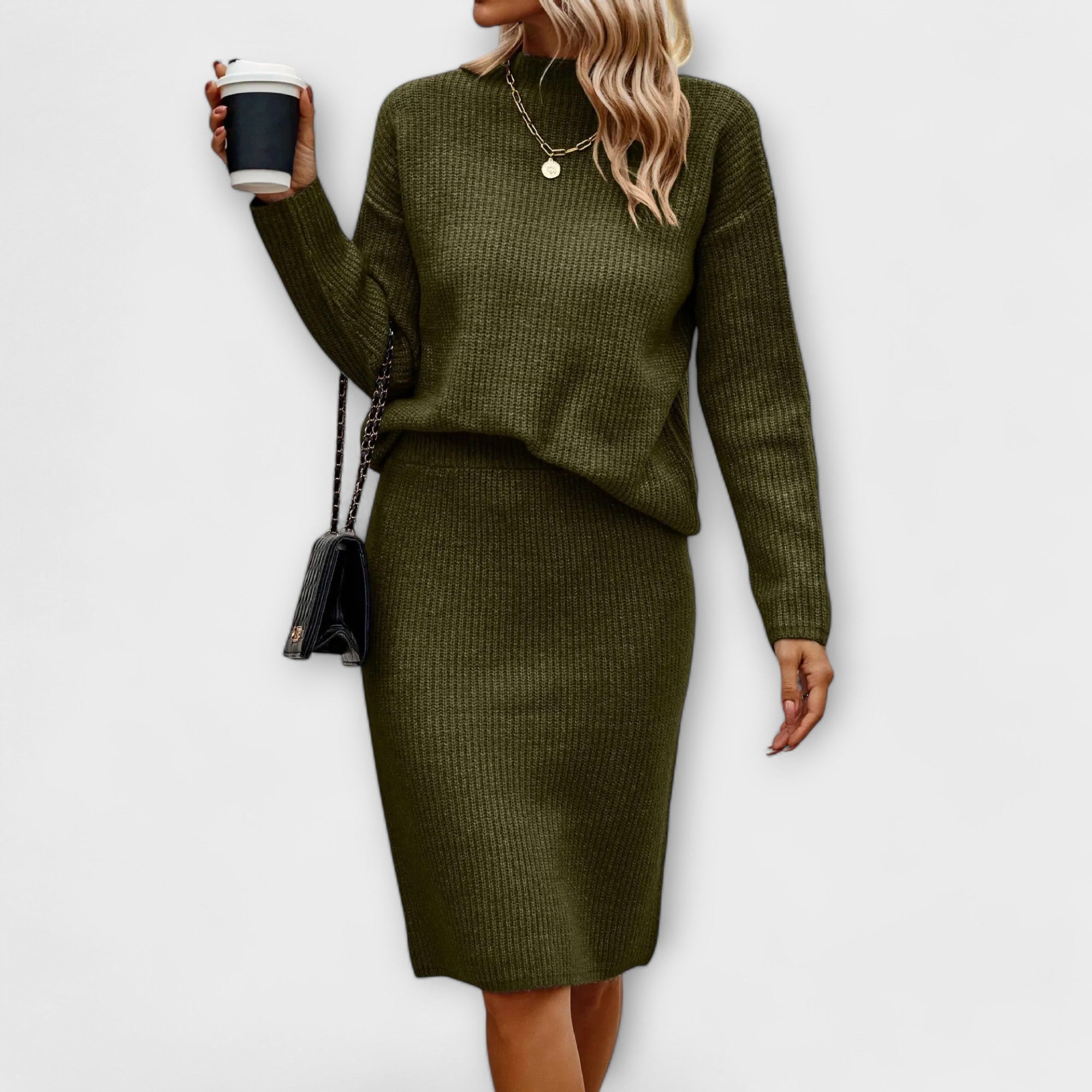 Complete with sweater and two-piece skirt.