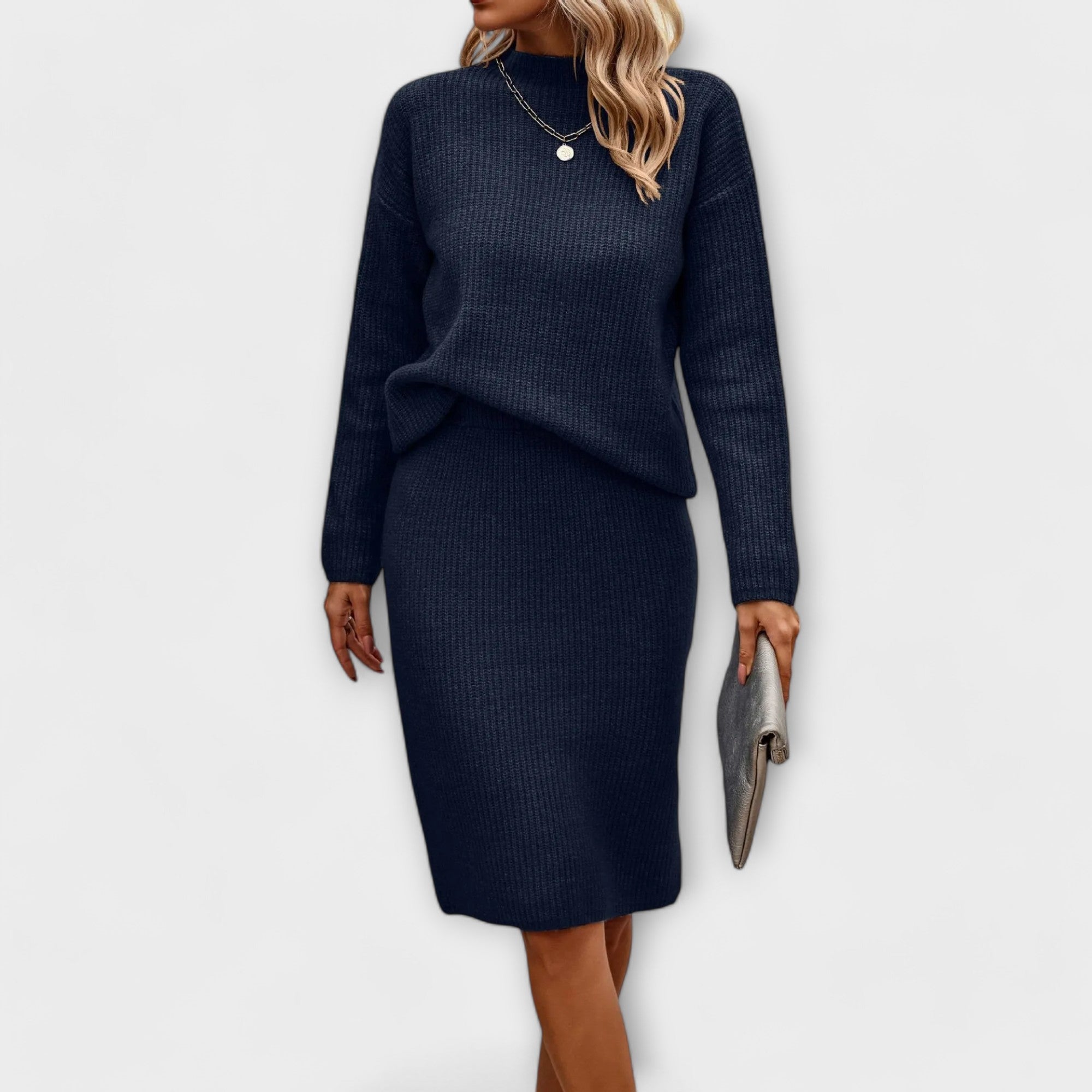 Complete with sweater and two-piece skirt.